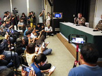 Metropolitan Police Bureau Commissioner Thiti Sangsawang is speaking as National Police Chief Torsak Sukvimol is looking on during a press c...