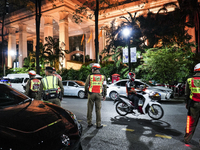 Police officers are standing outside the Grand Hyatt Erawan Hotel in Bangkok, Thailand, on July 16, 2024. Local news reports are saying that...