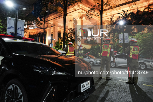 Police officers are standing outside the Grand Hyatt Erawan Hotel in Bangkok, Thailand, on July 16, 2024. Local news reports are saying that...