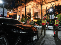 Police officers are standing outside the Grand Hyatt Erawan Hotel in Bangkok, Thailand, on July 16, 2024. Local news reports are saying that...