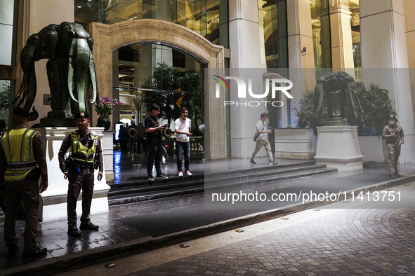 Police are gathering outside the Grand Hyatt Erawan Hotel in Bangkok, Thailand, on July 16, 2024. Local news reports are saying that at leas...