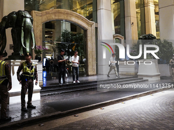 Police are gathering outside the Grand Hyatt Erawan Hotel in Bangkok, Thailand, on July 16, 2024. Local news reports are saying that at leas...