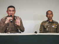 Metropolitan Police Bureau Commissioner Thiti Sangsawang is speaking as National Police Chief Torsak Sukvimol is looking on during a press c...