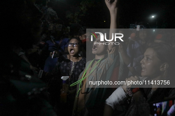 Anti-quota protestors are showing their injuries caused by the pro-government student wing to the police in Dhaka, Bangladesh, on July 16, 2...