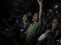 Anti-quota protestors are showing their injuries caused by the pro-government student wing to the police in Dhaka, Bangladesh, on July 16, 2...