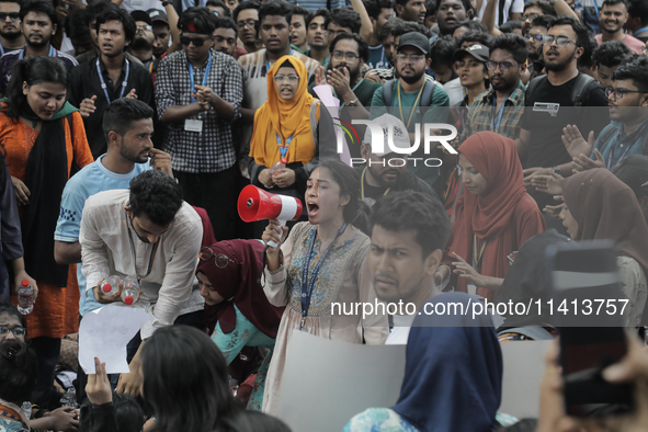 Anti-quota protestors are blocking the road following the death of fellow protesters during a clash with the pro-government student wing in...