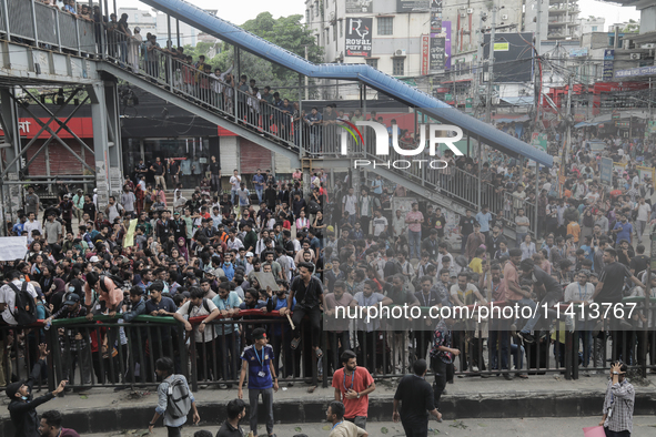 Anti-quota protestors are blocking the road following the death of fellow protesters during a clash with the pro-government student wing in...