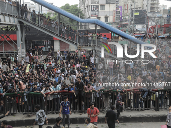 Anti-quota protestors are blocking the road following the death of fellow protesters during a clash with the pro-government student wing in...