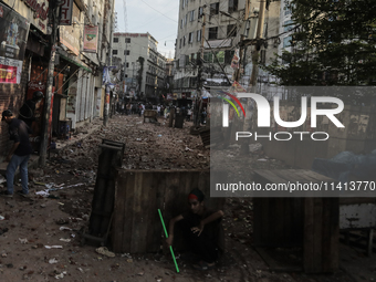 Pro-government student wing and anti-quota protestors are clashing in Dhaka, Bangladesh, on July 16, 2024. (