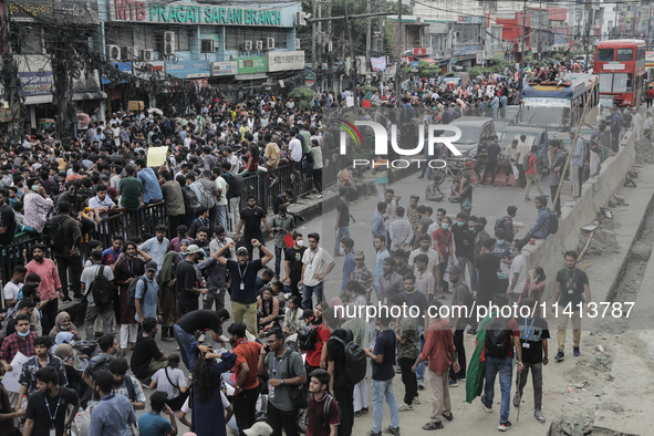 Anti-quota protestors are blocking the road following the death of fellow protesters during a clash with the pro-government student wing in...