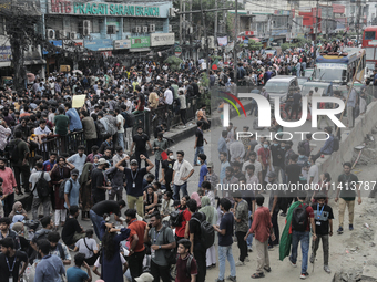 Anti-quota protestors are blocking the road following the death of fellow protesters during a clash with the pro-government student wing in...