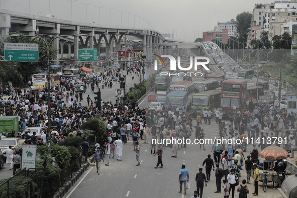 Anti-quota protestors are blocking the road following the death of fellow protesters during a clash with the pro-government student wing in...