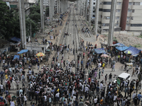 Anti-quota protestors are blocking the road following the death of fellow protesters during a clash with the pro-government student wing in...