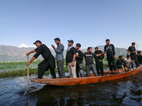 Kashmiri Shia Muslims are mourning as they are taking part in the Ashura procession in boats in the interiors of Dal Lake in Srinagar, India...