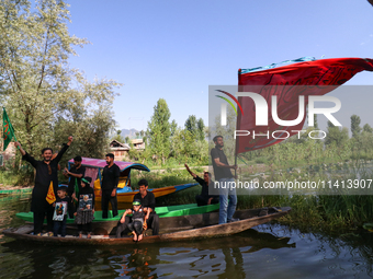 Kashmiri Shia Muslims are mourning as they are taking part in the Ashura procession in boats in the interiors of Dal Lake in Srinagar, India...