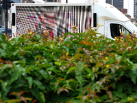 A truck displaying activists' messages is parked in the street adjacent to Red Arrow Park in Milwaukee, Wisconsin on July 16, 2024 as demons...