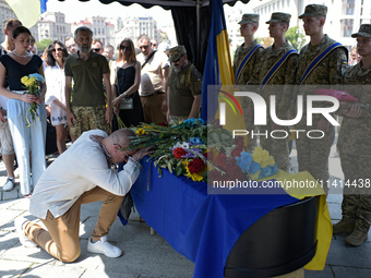 People are paying their last respects to the commander of the OUN volunteer battalion Mykola Kokhanivskyi, who died near Vovchansk in Kharki...