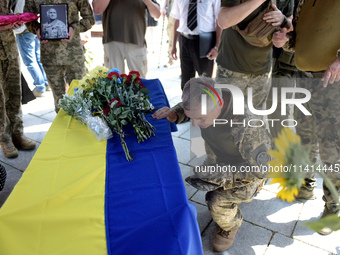 Servicemen are paying their last respects to the commander of the OUN volunteer battalion Mykola Kokhanivskyi, who died near Vovchansk in Kh...