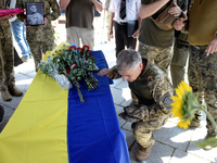 Servicemen are paying their last respects to the commander of the OUN volunteer battalion Mykola Kokhanivskyi, who died near Vovchansk in Kh...