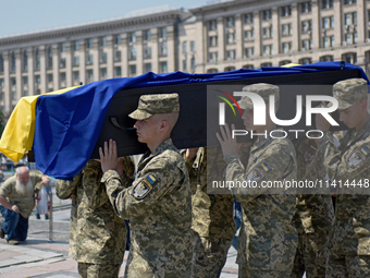 Servicewomen are carrying the coffin of the commander of the OUN volunteer battalion Mykola Kokhanivskyi, who died near Vovchansk in Kharkiv...