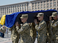 Servicewomen are carrying the coffin of the commander of the OUN volunteer battalion Mykola Kokhanivskyi, who died near Vovchansk in Kharkiv...