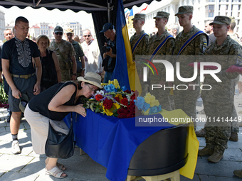 People are paying their last respects to the commander of the OUN volunteer battalion Mykola Kokhanivskyi, who died near Vovchansk in Kharki...