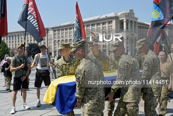 Servicewomen are carrying the coffin of the commander of the OUN volunteer battalion Mykola Kokhanivskyi, who died near Vovchansk in Kharkiv...