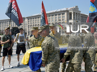 Servicewomen are carrying the coffin of the commander of the OUN volunteer battalion Mykola Kokhanivskyi, who died near Vovchansk in Kharkiv...