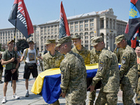 Servicewomen are carrying the coffin of the commander of the OUN volunteer battalion Mykola Kokhanivskyi, who died near Vovchansk in Kharkiv...