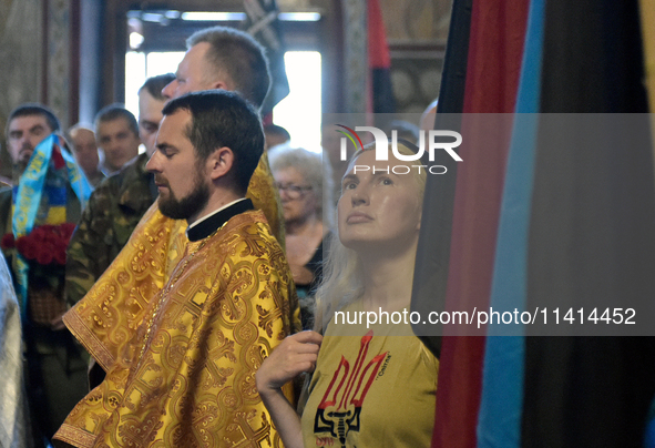 Kateryna is attending a memorial service for the commander of the OUN volunteer battalion, Mykola Kokhanivskyi, who died near Vovchansk in K...