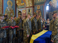 Servicemen are flanking the coffin of the commander of the OUN volunteer battalion Mykola Kokhanivskyi, who died near Vovchansk in Kharkiv r...