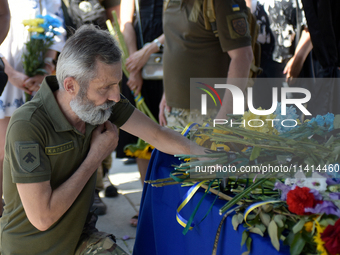 Servicemen are paying their last respects to the commander of the OUN volunteer battalion Mykola Kokhanivskyi, who died near Vovchansk in Kh...