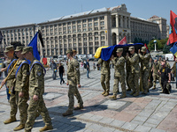 Servicewomen are carrying the coffin of the commander of the OUN volunteer battalion Mykola Kokhanivskyi, who died near Vovchansk in Kharkiv...