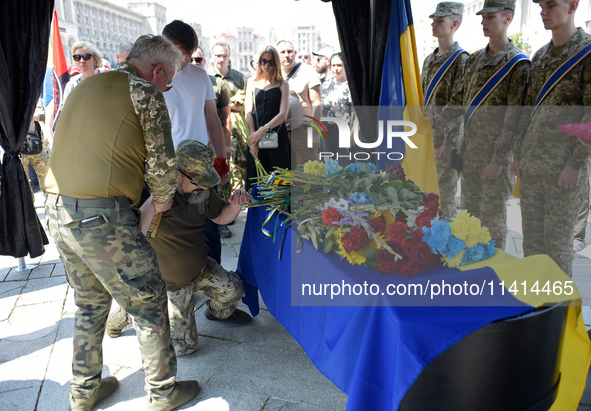 Servicemen are paying their last respects to the commander of the OUN volunteer battalion Mykola Kokhanivskyi, who died near Vovchansk in Kh...