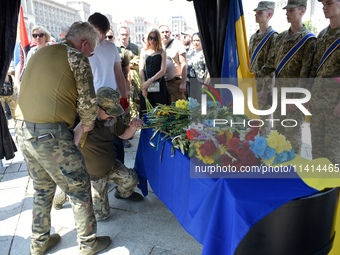 Servicemen are paying their last respects to the commander of the OUN volunteer battalion Mykola Kokhanivskyi, who died near Vovchansk in Kh...