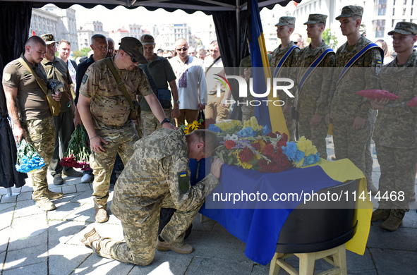 Servicemen are paying their last respects to the commander of the OUN volunteer battalion Mykola Kokhanivskyi, who died near Vovchansk in Kh...