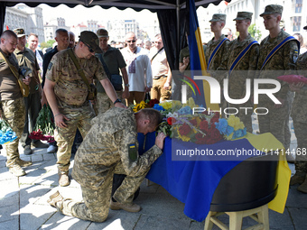 Servicemen are paying their last respects to the commander of the OUN volunteer battalion Mykola Kokhanivskyi, who died near Vovchansk in Kh...