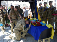 Servicemen are paying their last respects to the commander of the OUN volunteer battalion Mykola Kokhanivskyi, who died near Vovchansk in Kh...