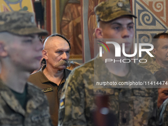 Servicemen are attending a memorial service for the commander of the OUN volunteer battalion Mykola Kokhanivskyi, who died near Vovchansk in...