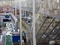 Workers are producing seats ordered by NIO on an assembly line at a workshop of a seating company in Hefei, Anhui province, China, on July 1...