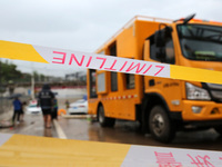 Law enforcement officers of Shizhong District Comprehensive Administrative Law Enforcement Bureau are using a drainage emergency vehicle to...