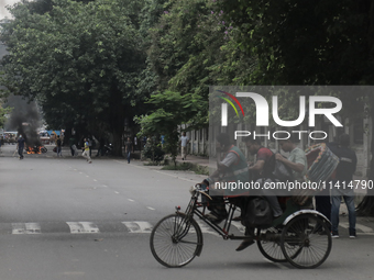 Students are leaving the Dhaka University dormitory as violence is erupting in Dhaka, Bangladesh, on July 17, 2024. (