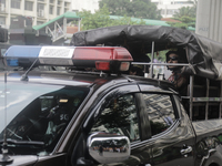 Police officers are checking IDs of civilians as the entrance of Dhaka University area is restricted due to violence in Dhaka, Bangladesh, o...