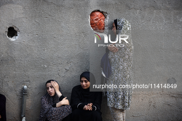 Palestinian women are reacting at the site of an Israeli strike on a house, in Nuseirat, central Gaza Strip, on July 17, 2024, amid the ongo...