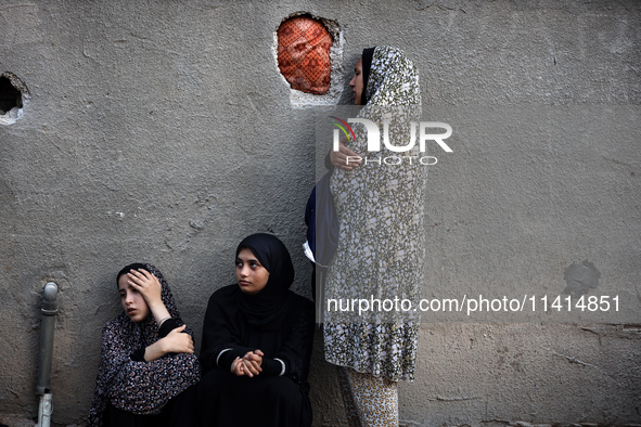 Palestinian women are reacting at the site of an Israeli strike on a house, in Nuseirat, central Gaza Strip, on July 17, 2024, amid the ongo...