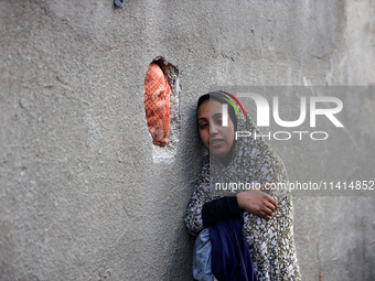 Palestinian women are reacting at the site of an Israeli strike on a house, in Nuseirat, central Gaza Strip, on July 17, 2024, amid the ongo...