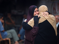 Palestinian women are reacting at the site of an Israeli strike on a house, in Nuseirat, central Gaza Strip, on July 17, 2024, amid the ongo...