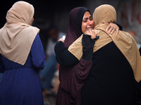 Palestinian women are reacting at the site of an Israeli strike on a house, in Nuseirat, central Gaza Strip, on July 17, 2024, amid the ongo...