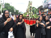 A Shiite Muslim woman is breaking down as she mourns during a procession to mark Ashura, in south Kolkata, India, on July 17, 2024. Ashura i...