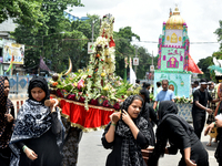 A Shiite Muslim woman is breaking down as she mourns during a procession to mark Ashura, in south Kolkata, India, on July 17, 2024. Ashura i...